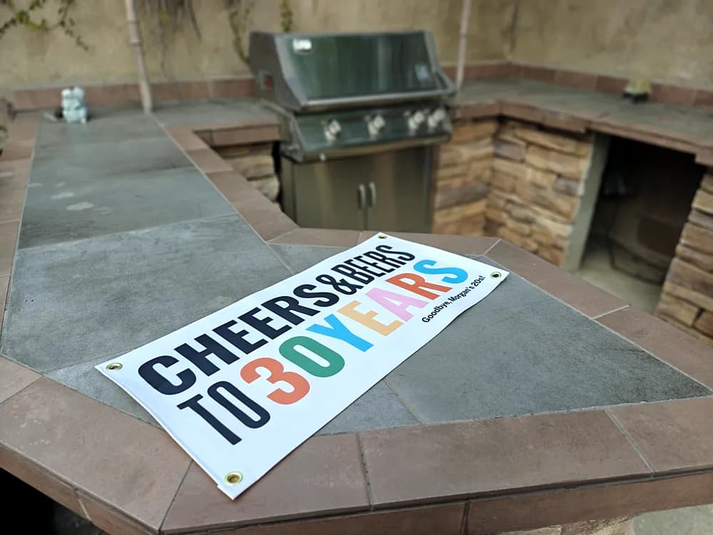 Printed vinyl banner reading Cheers and Beers to 30 Years