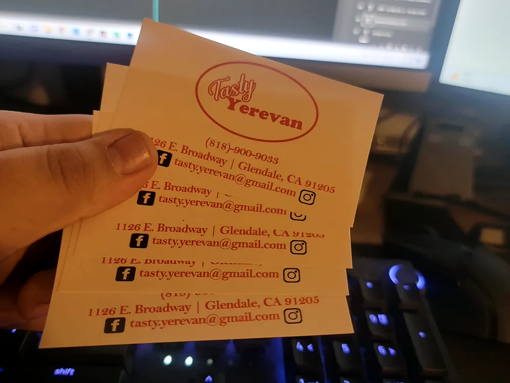 Orange business cards with contact details for Tasty Yerevan on East Broadway, Glendale