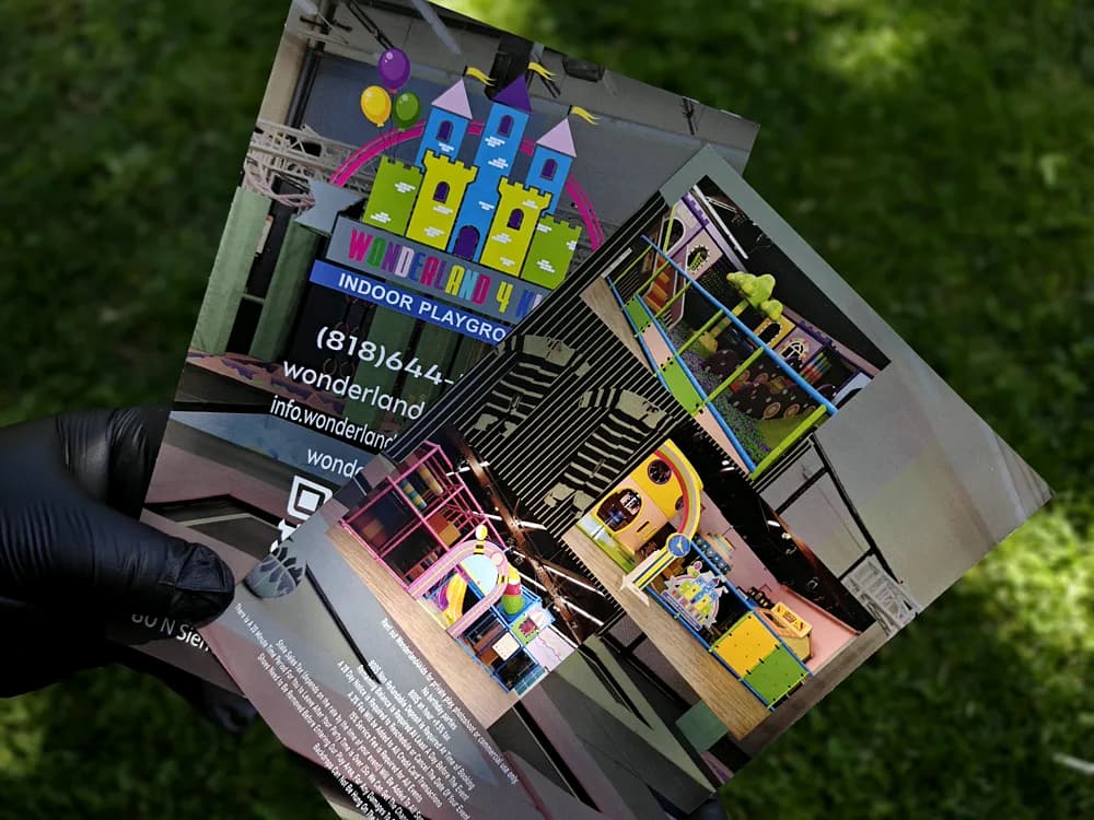 Full-colour promotional cards showing an indoor playground