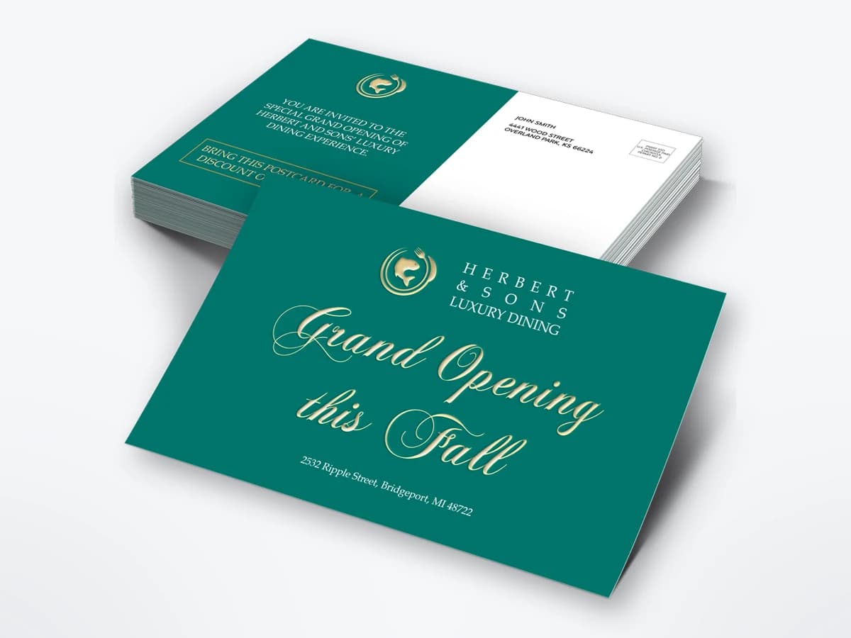 A stack of teal postcards with gold lettering