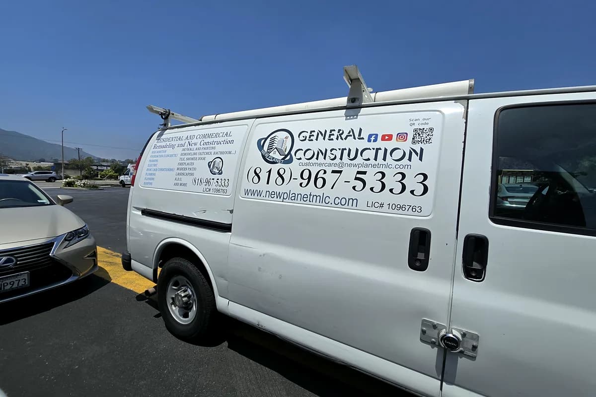 Work van with printed vehicle graphics and contact details for General Gas Construction