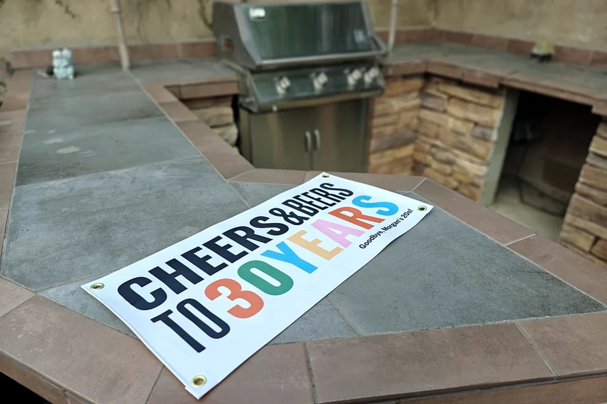Printed vinyl celebration banner reading Cheers and Beers to 30 Years